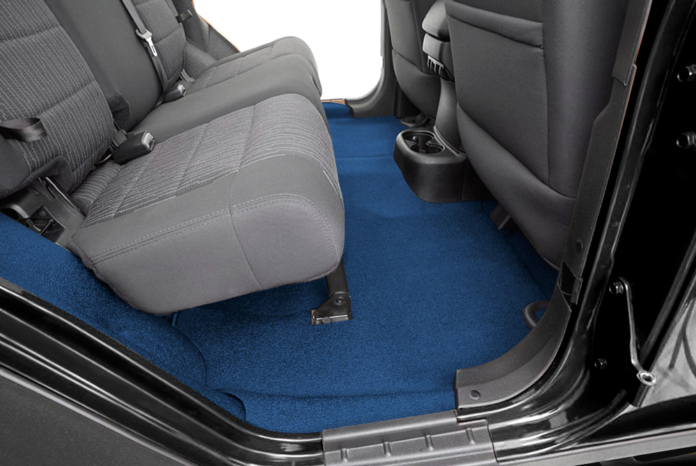 interior of a car with grey seats and blue carpet